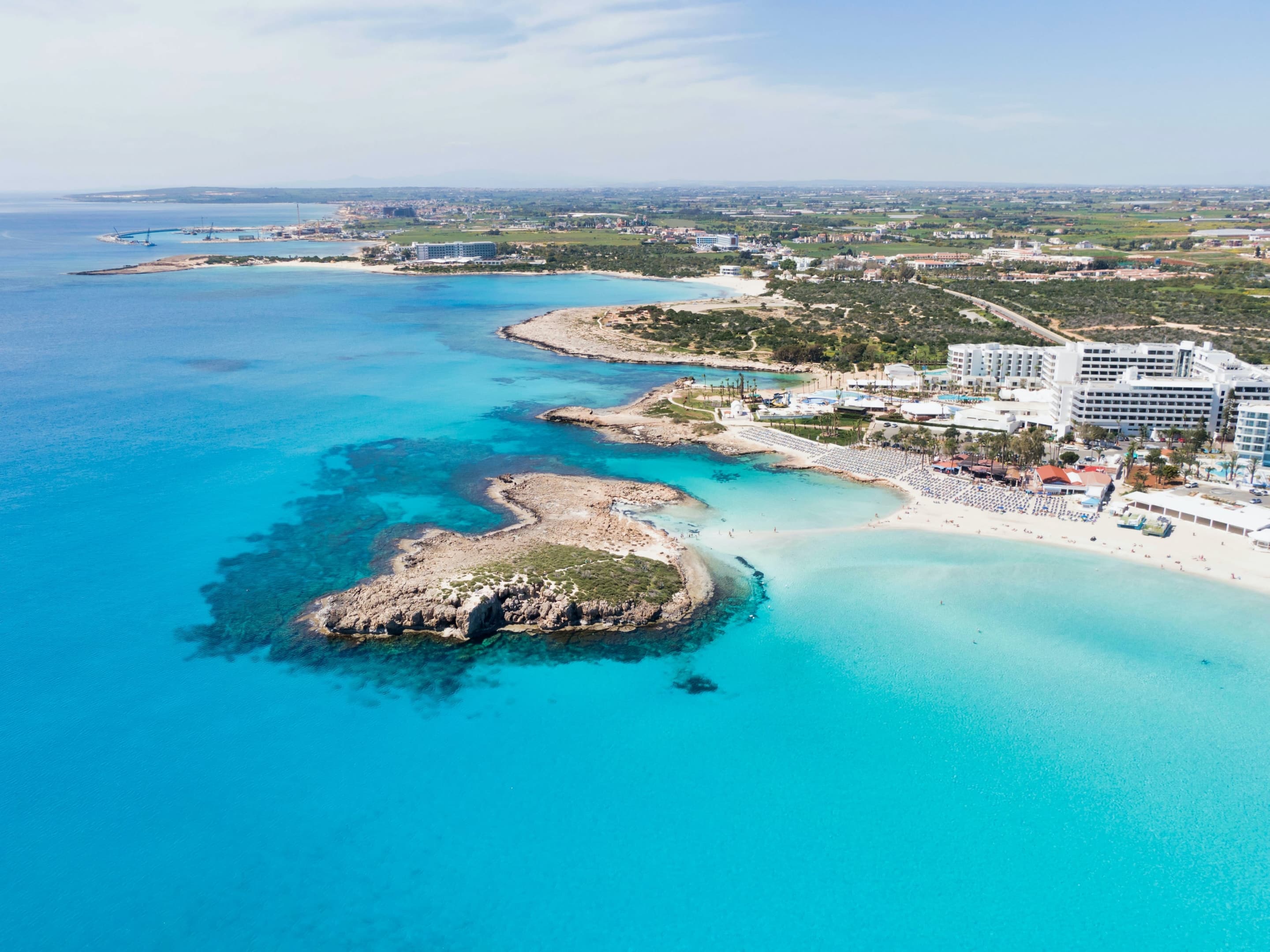 Photo of the sea, next to the beach and the island.