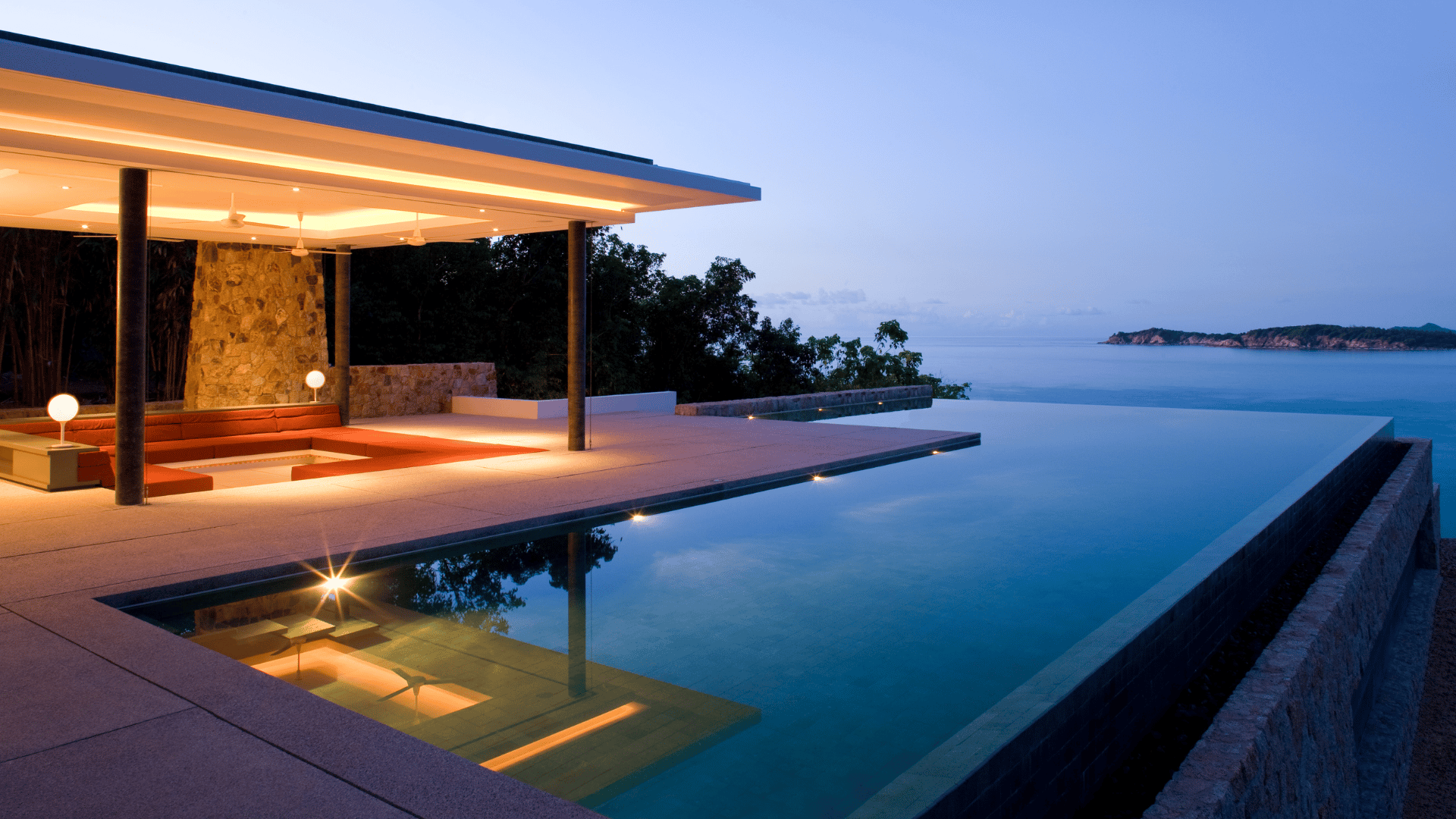 The evening light graces the exteriors and infinity pool at one of Ezoria villas in Cyprus